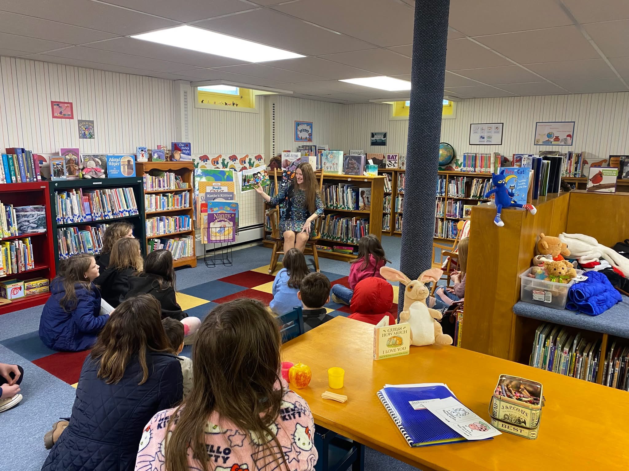 Jodie Bonville reading to children at a public library event