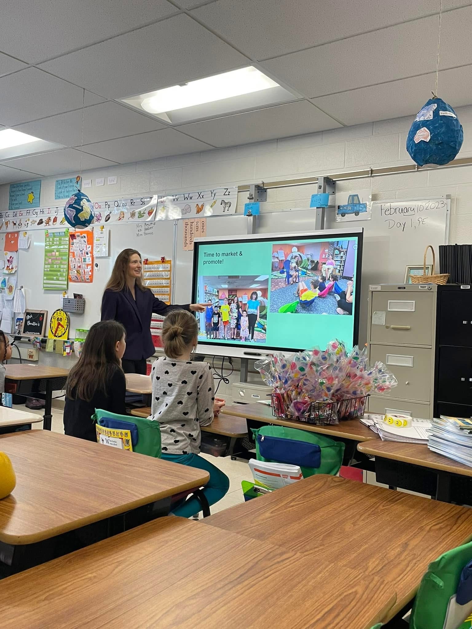 Jodie Bonville teaching a lesson to elementary students in a classroom